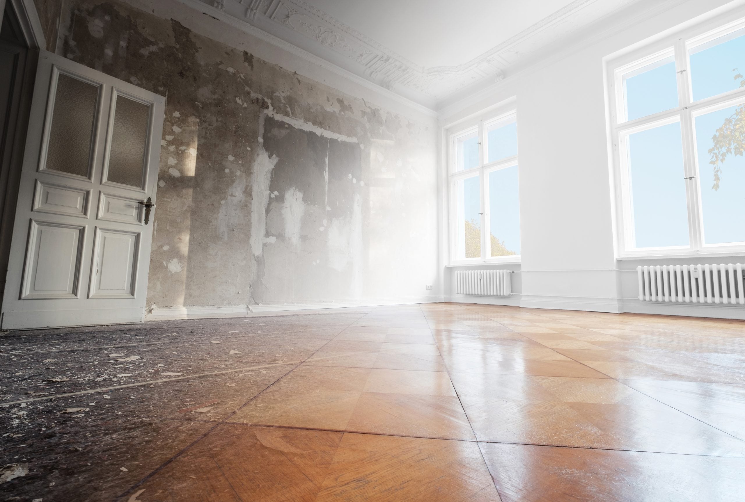 An empty room in home has smoke damage and needs repair